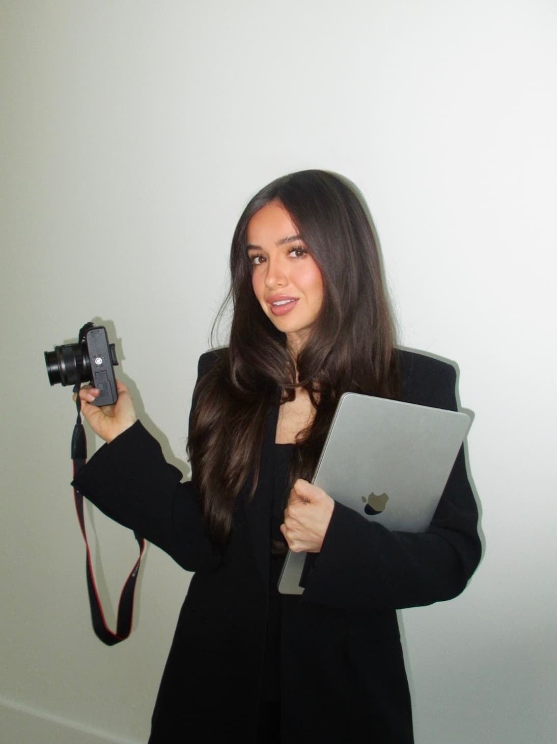 Chlo, social media manager, seated with a laptop